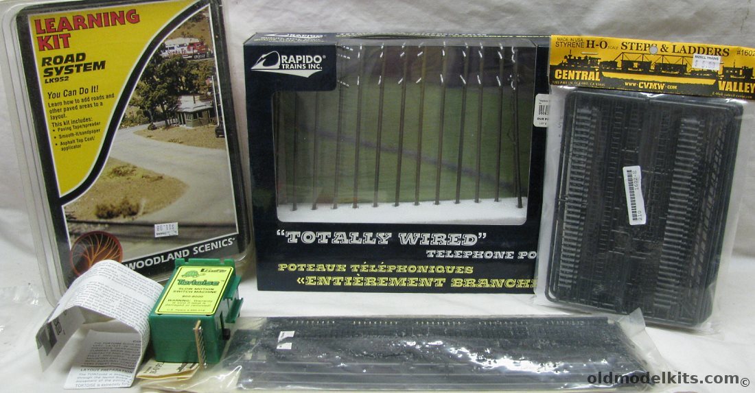  HO Tortoise Slow Motion Switch Machine 800-6000 / Rapido Trains HO Scale Totally Wired Telephone Poles #3000001 / Woodland Scenics Road System L952 / Central Valley #1903 HO Scale Plate Girder Bridge (72 Feet) / Central Valley #1602 Steps and Ladders plastic model kit